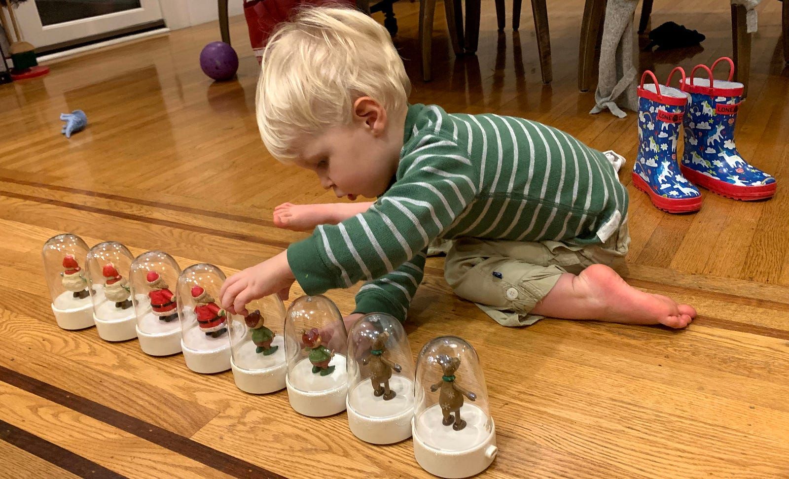 the kid playing with happy tappers